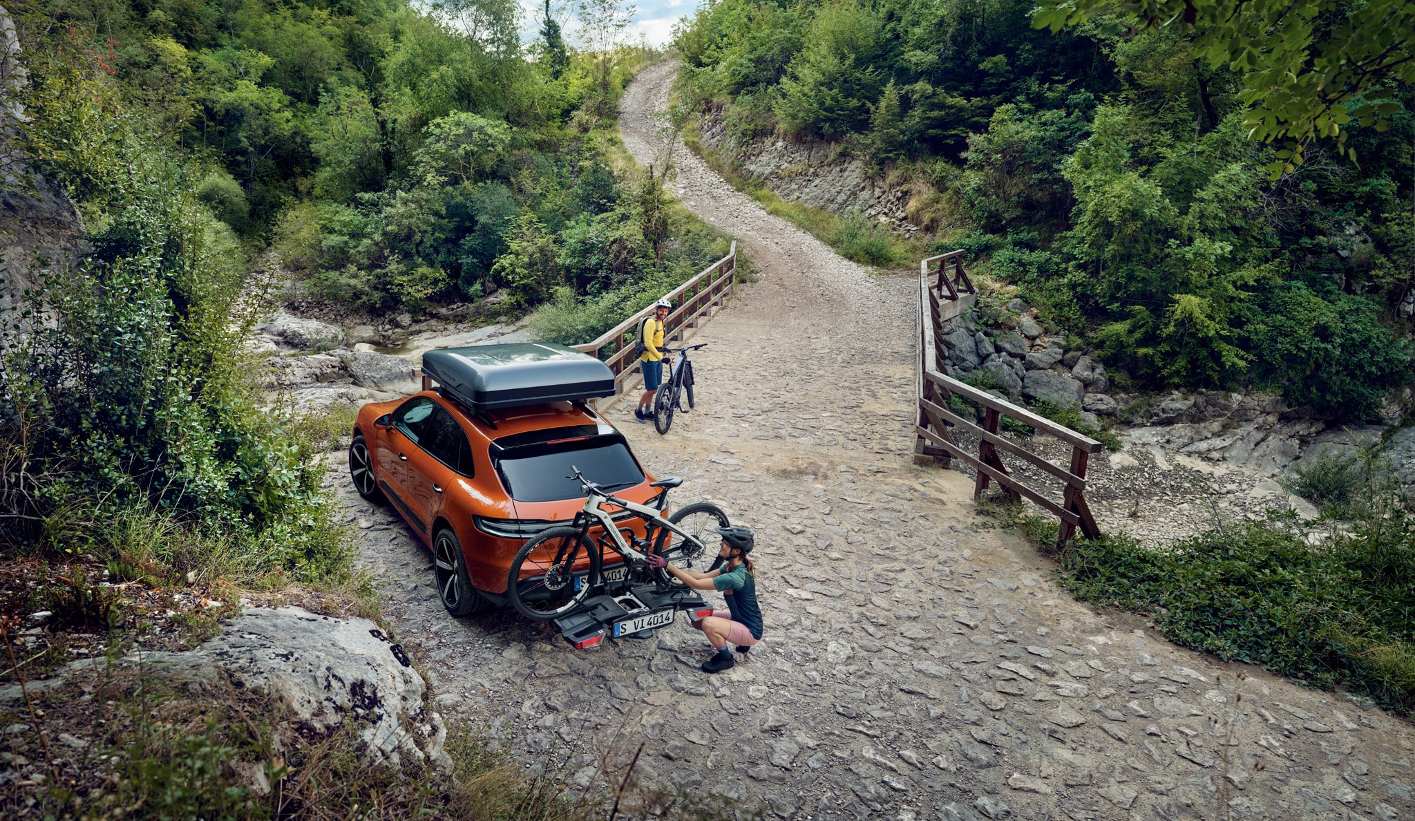  Porsche Macan on dirt road with bike rack