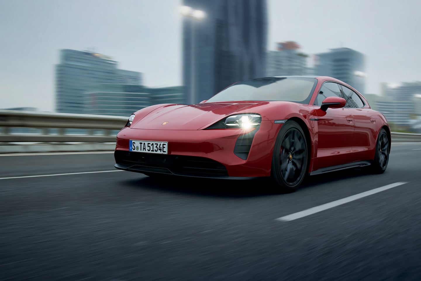  2026 Porsche Taycan driving in city