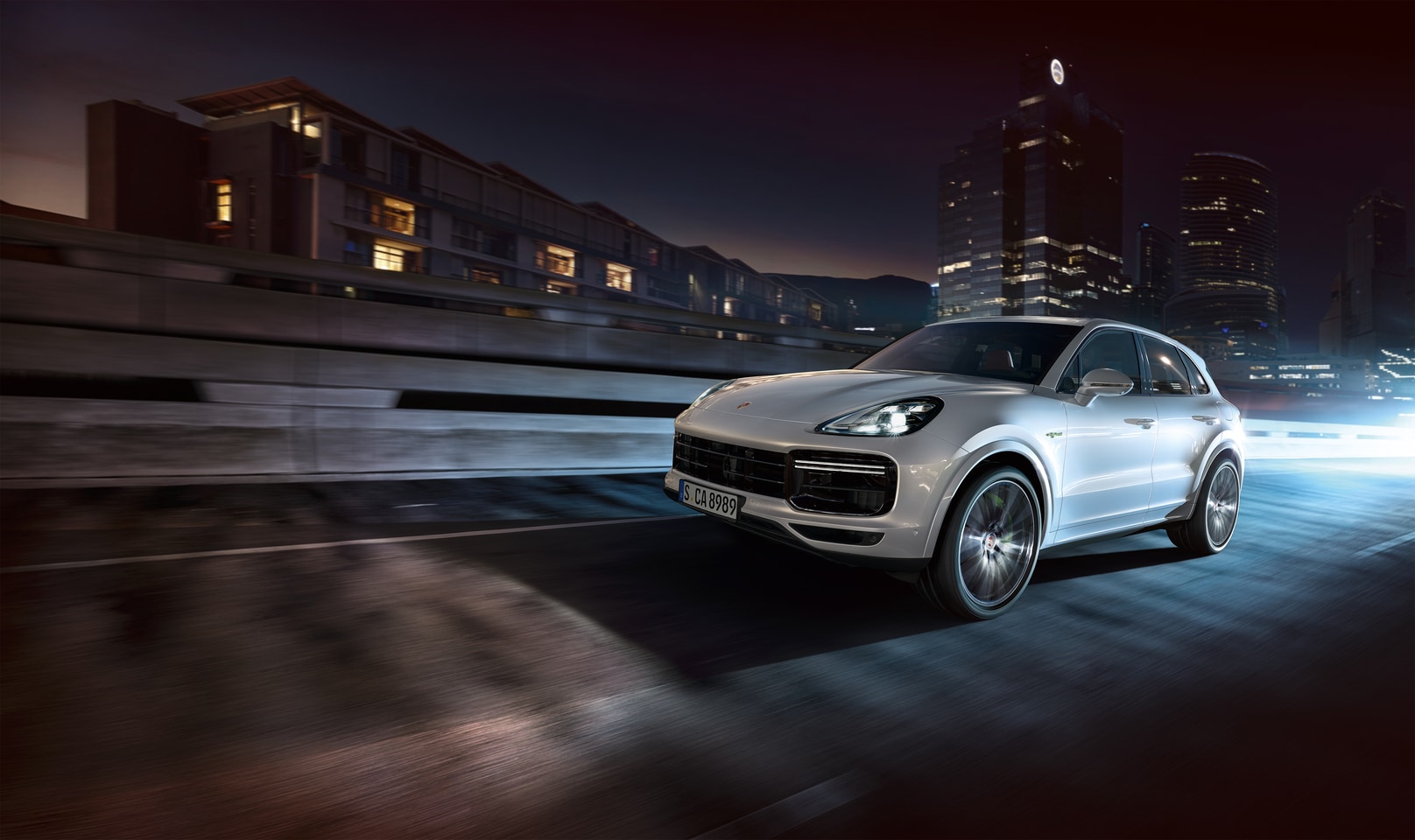  2026 Porsche Cayenne driving in city at night