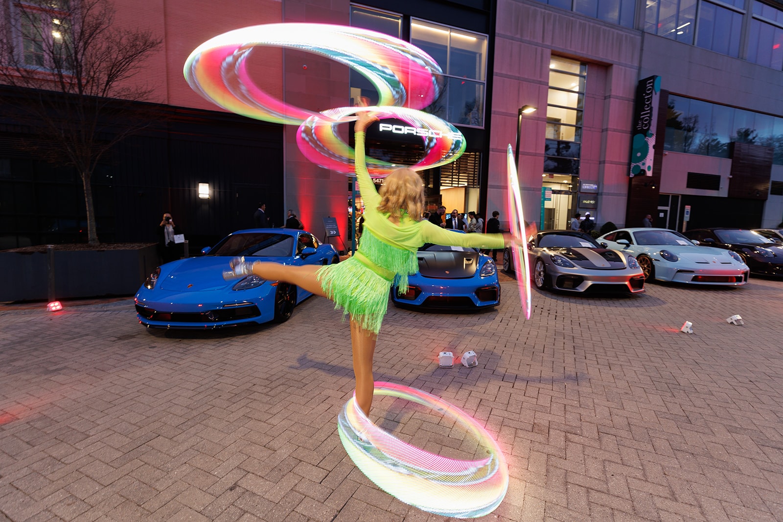 Porsche Studio Chevy Chase Grand Opening Event Miss Molly Dazzle performing outside of the Porsche Studio Chevy Chase Grand Opening Event