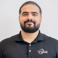 Staff member Adrian Escalante from ID_432742