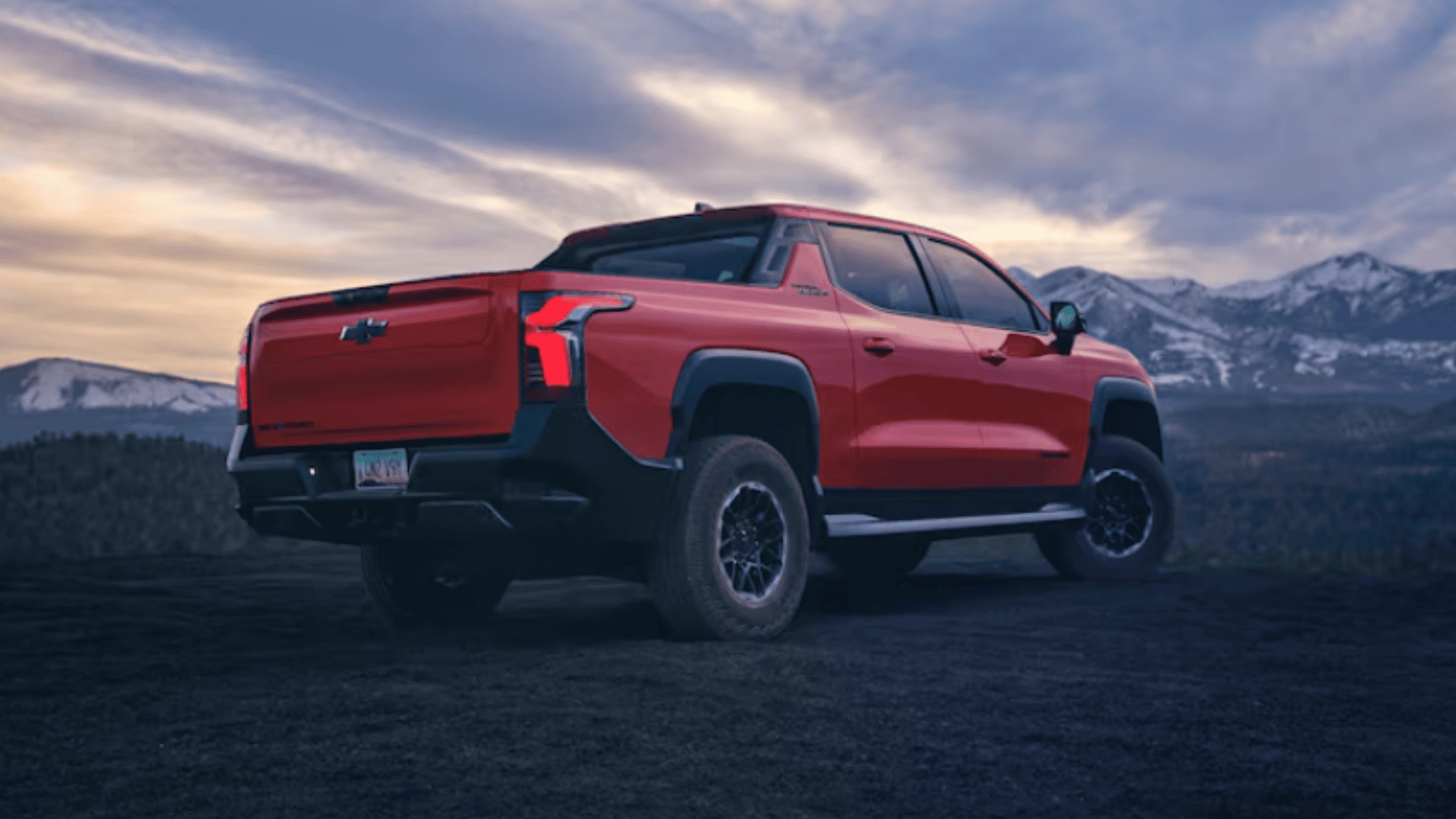 2026 Chevrolet Silverado EV parked with mountain views near Fort Bragg at sunset