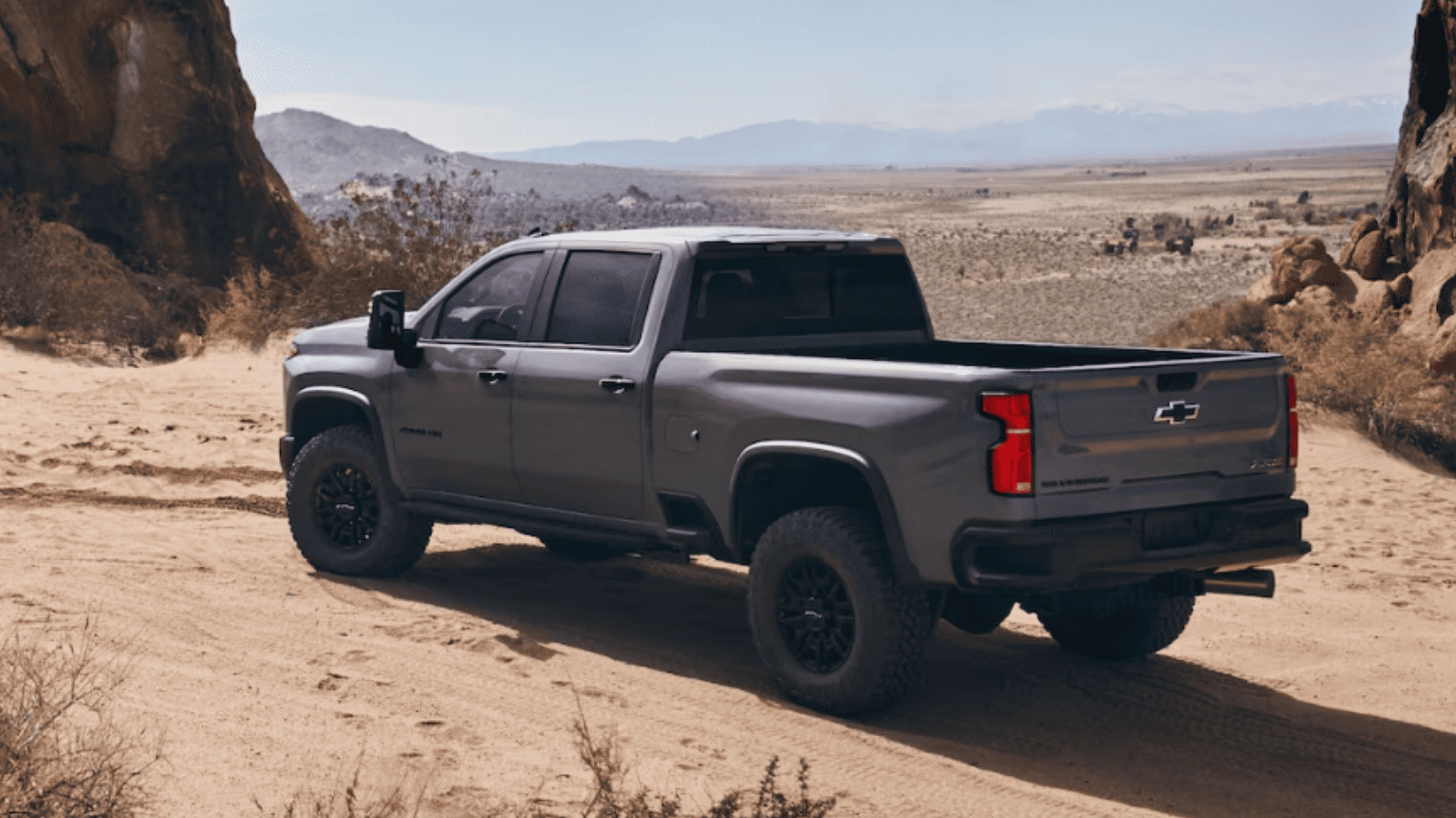 2025 Chevrolet Silverado HD driving off-road near Fort Bragg, built for tough contractor jobs