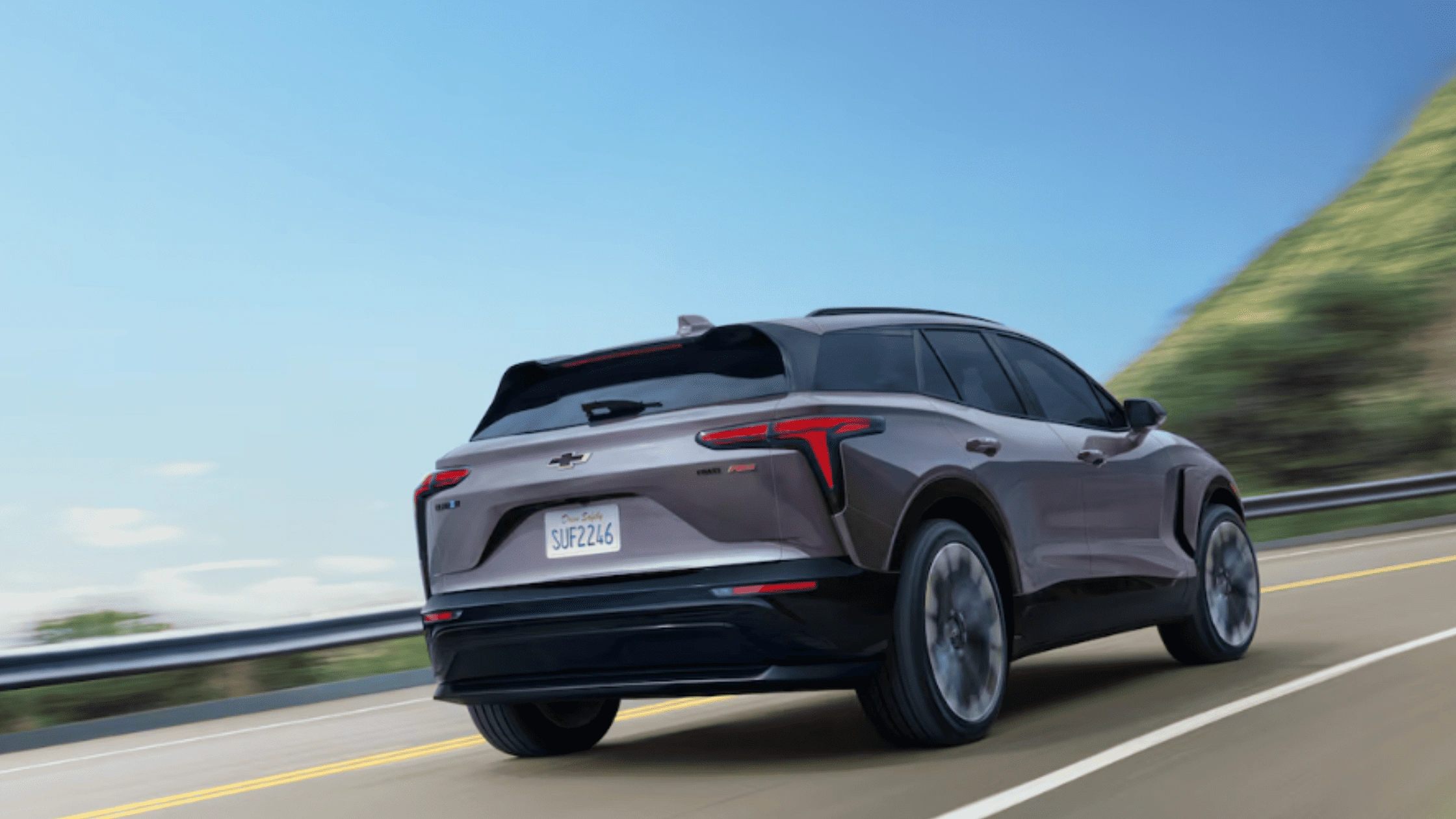 2025 Chevrolet Blazer EV cruising on scenic highway near Fort Bragg