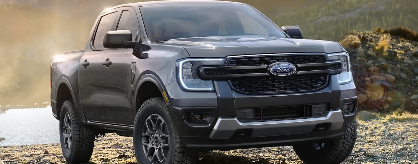 A grey 2024 Ford Ranger XLT parked on a trail near water after leaving a Ford dealer near you.