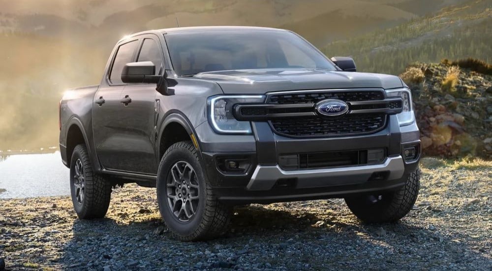 A grey 2024 Ford Ranger XLT Sport parked near a body of water after leaving a Ford dealer near Queens.