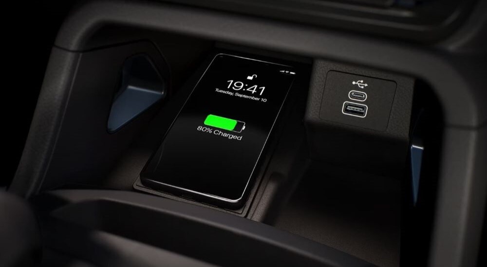 A close up of a phone charging wirelessly in a 2024 Ford Ranger.