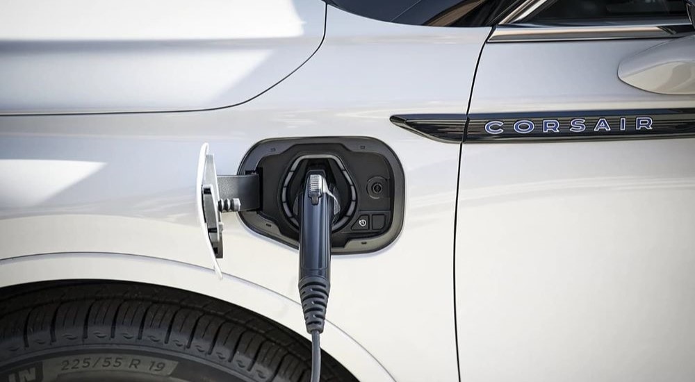 A close up of the charging port on a white 2023 Lincoln Corsair GT PHEV.
