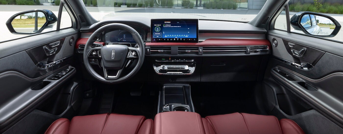 The red interior of a 2023 Lincoln Corsair is shown from above the center console.