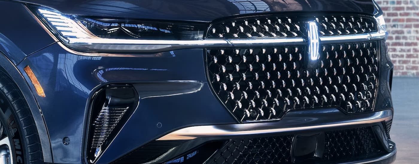A close up of the grille of a blue 2024 Lincoln Nautilus for sale is shown.