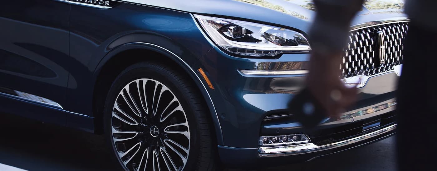 A close up of the front of a blue 2023 Lincoln Aviator at a Lincoln dealer near Staten Island.