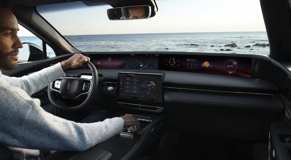 Interior view of a 2024 Lincoln Nautilus, showing the wrap-around digital dashboard.