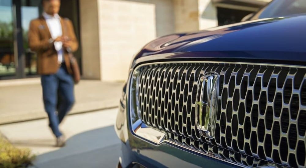 A close up of the grille on a blue 2024 Lincoln