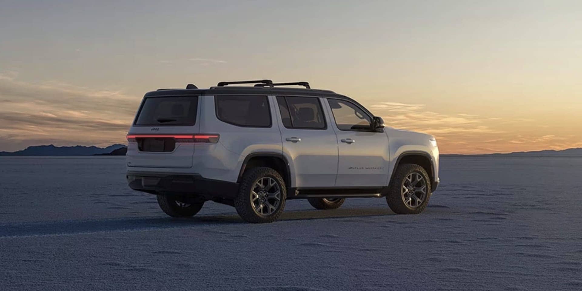 2026 Jeep Grand Wagoneer exterior rear quarter view showing stance and wheels