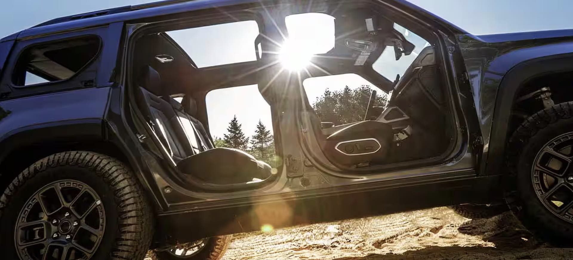 2026 Jeep Recon exterior showing removable doors and all-terrain tires