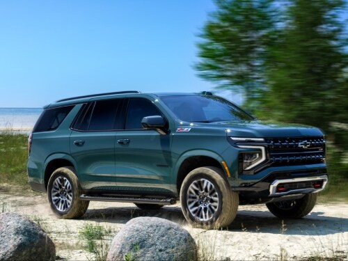 2025 Chevrolet Tahoe driving on a sandy road