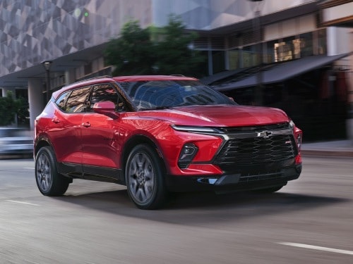 2026 Chevrolet Blazer driving fast down a city street