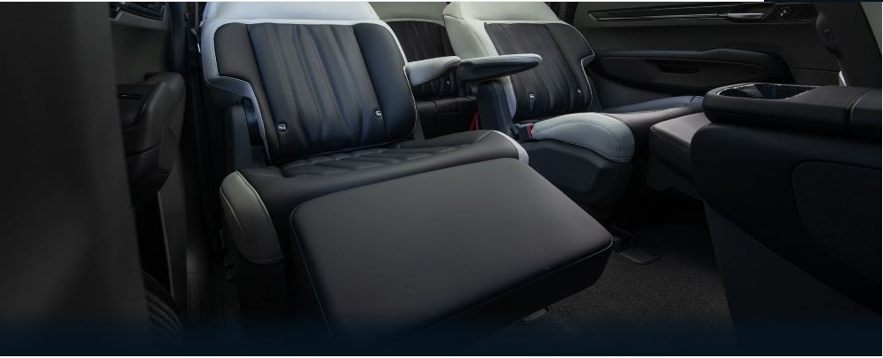 The New Kia EV9, A Luxurious three row suv with power captains chairs with comfortable reclining leg rests