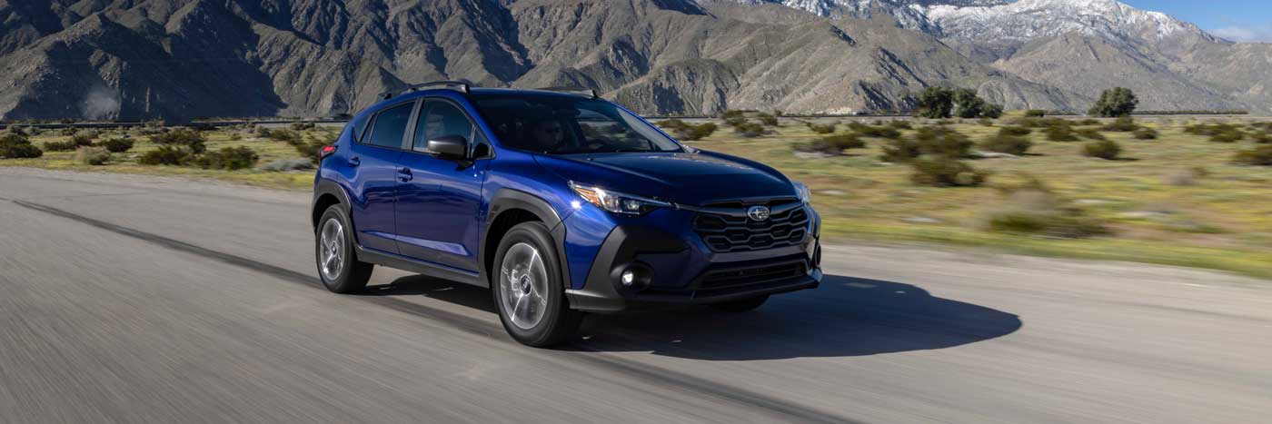 New 2024 Subaru Crosstrek driving through San Diego, CA