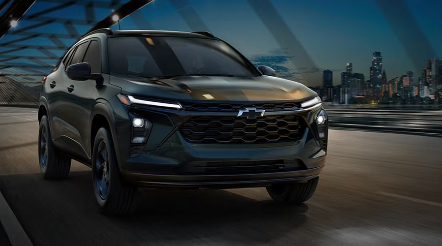 Front profile of a 2026 Chevrolet Trax driving smoothly through Massillon showing its bold stylish grille