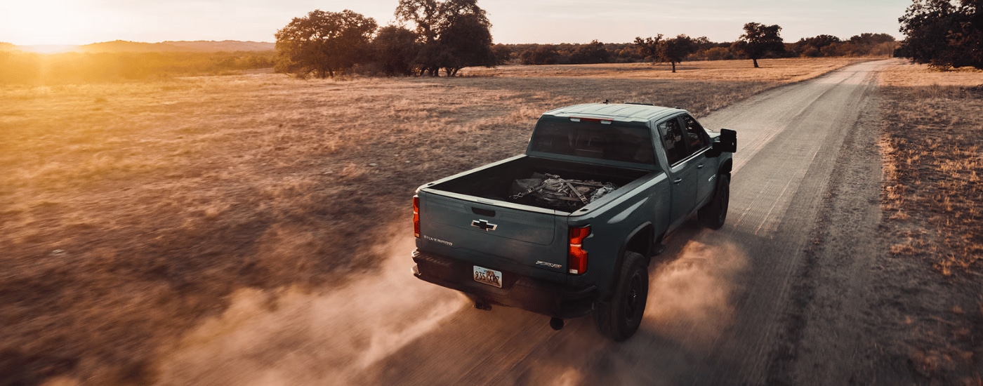 Grey 2026 Chevy Silverado 2500 HD ZR2 driving down a dusty trail