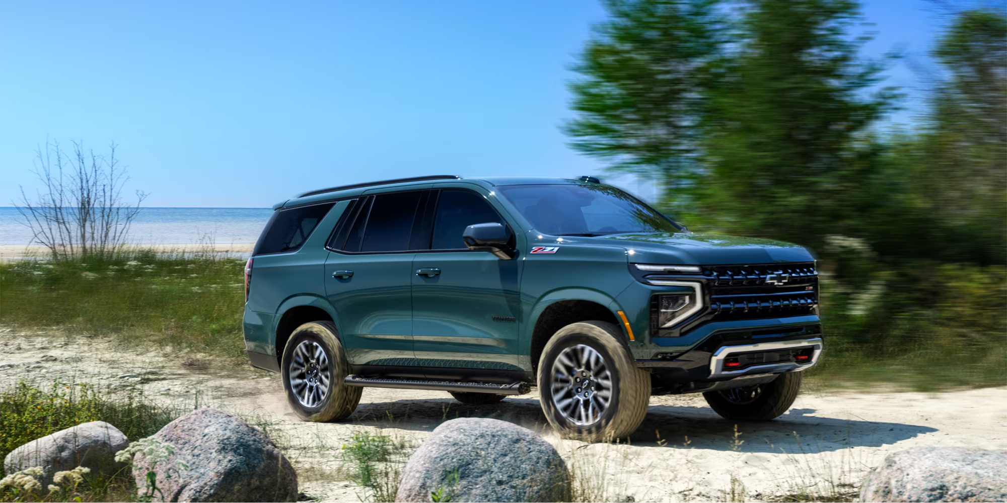 2026 Chevrolet Tahoe driving through Stark County Progressive Chevrolet in Massillon, OH