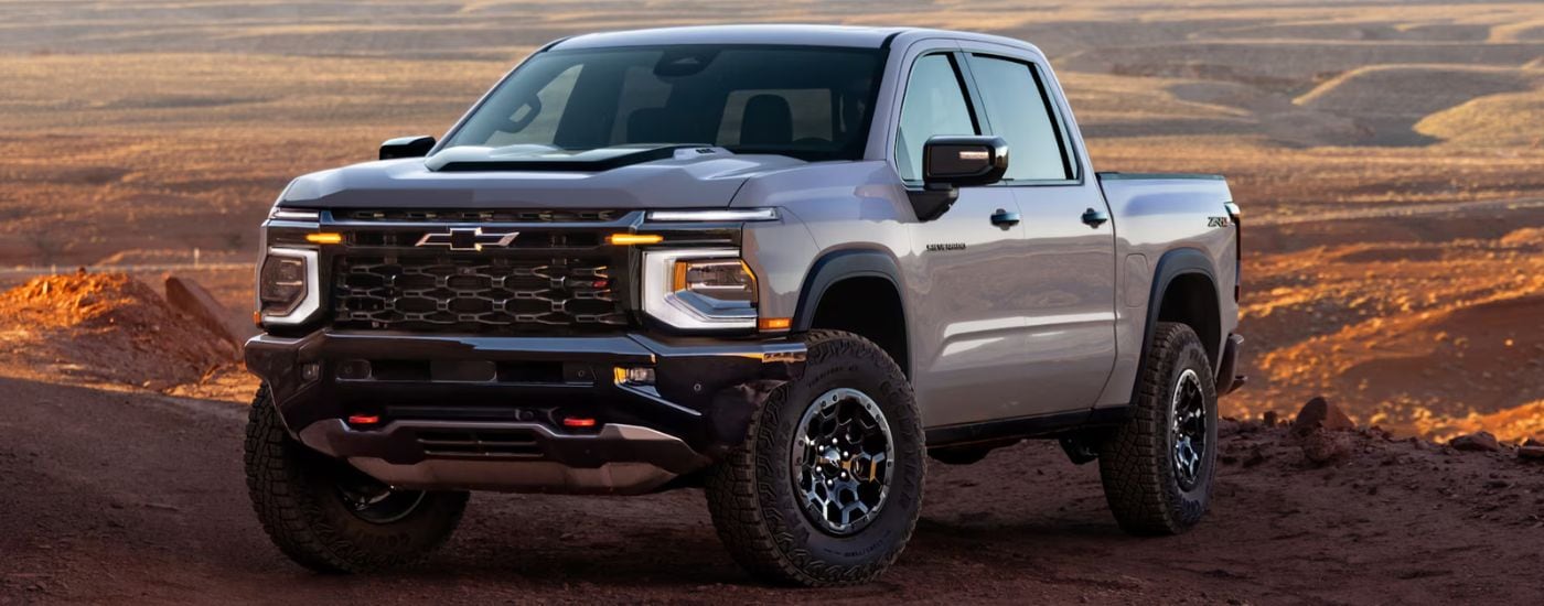Grey 2027 Chevy Silverado 1500 parked off-road at an angle