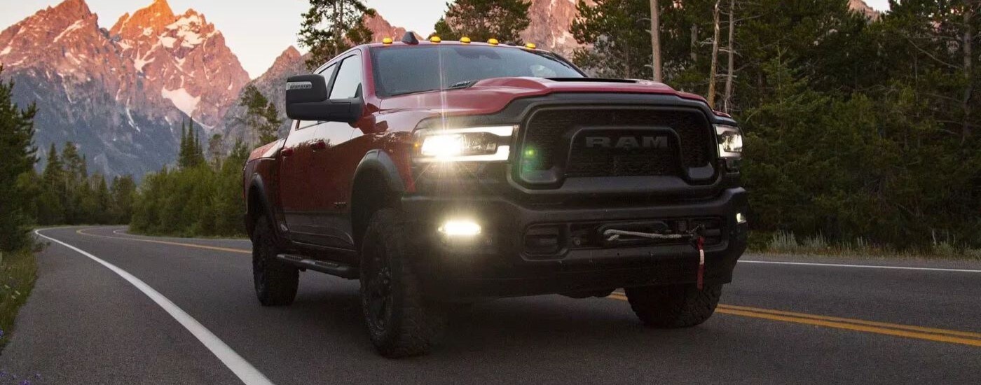 Red 2023 Ram 2500 Power Wagon driving along an open road