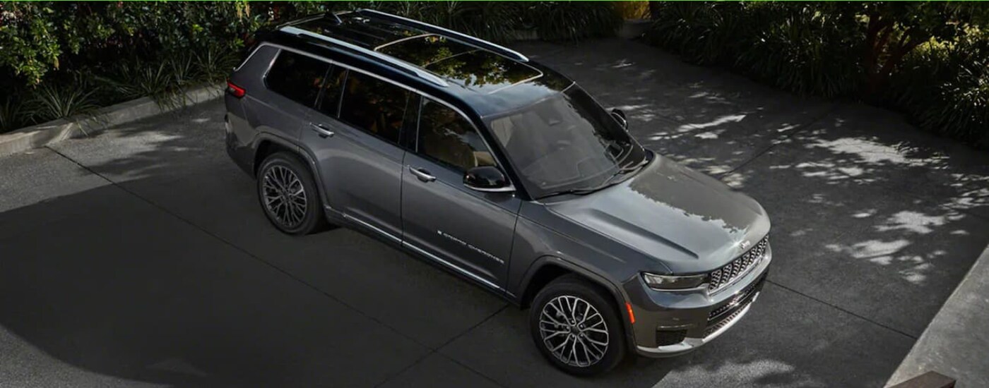 Silver 2021 Jeep Grand CHerokee parked in a spot from a high angle