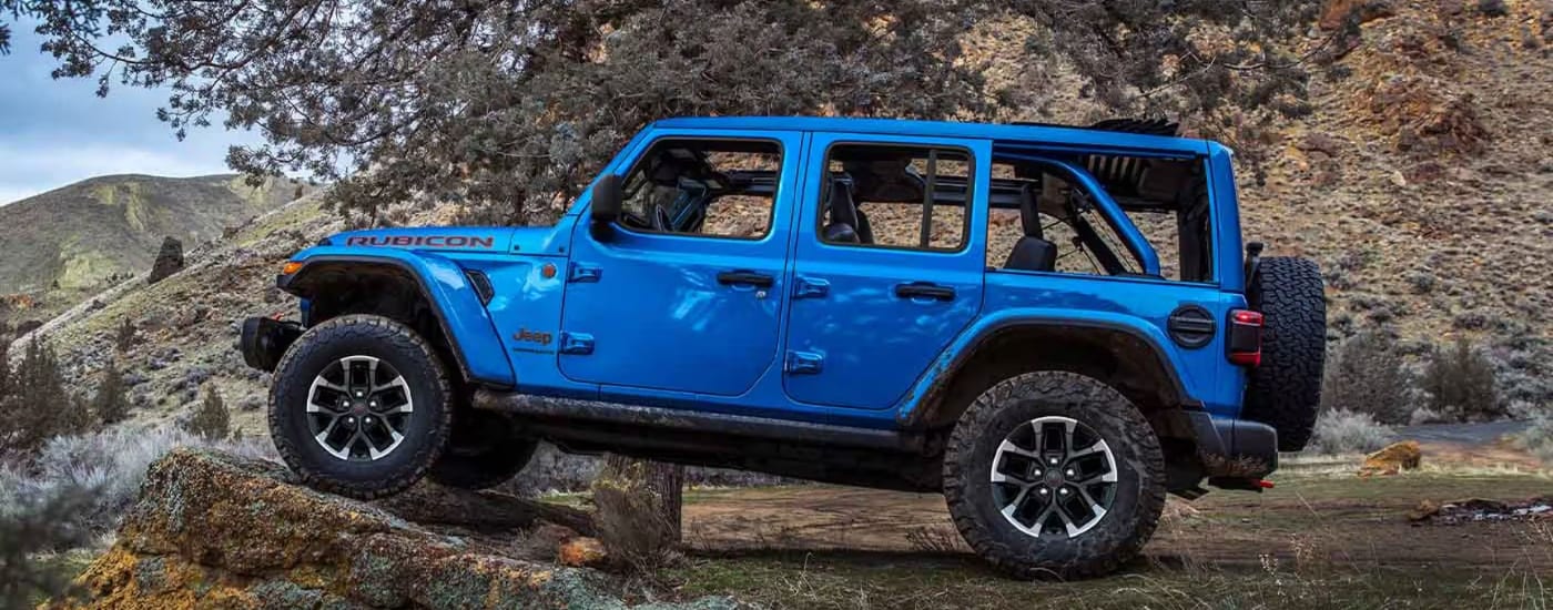 Blue 2025 Jeep Wranger Rubicon 392 parked off-road