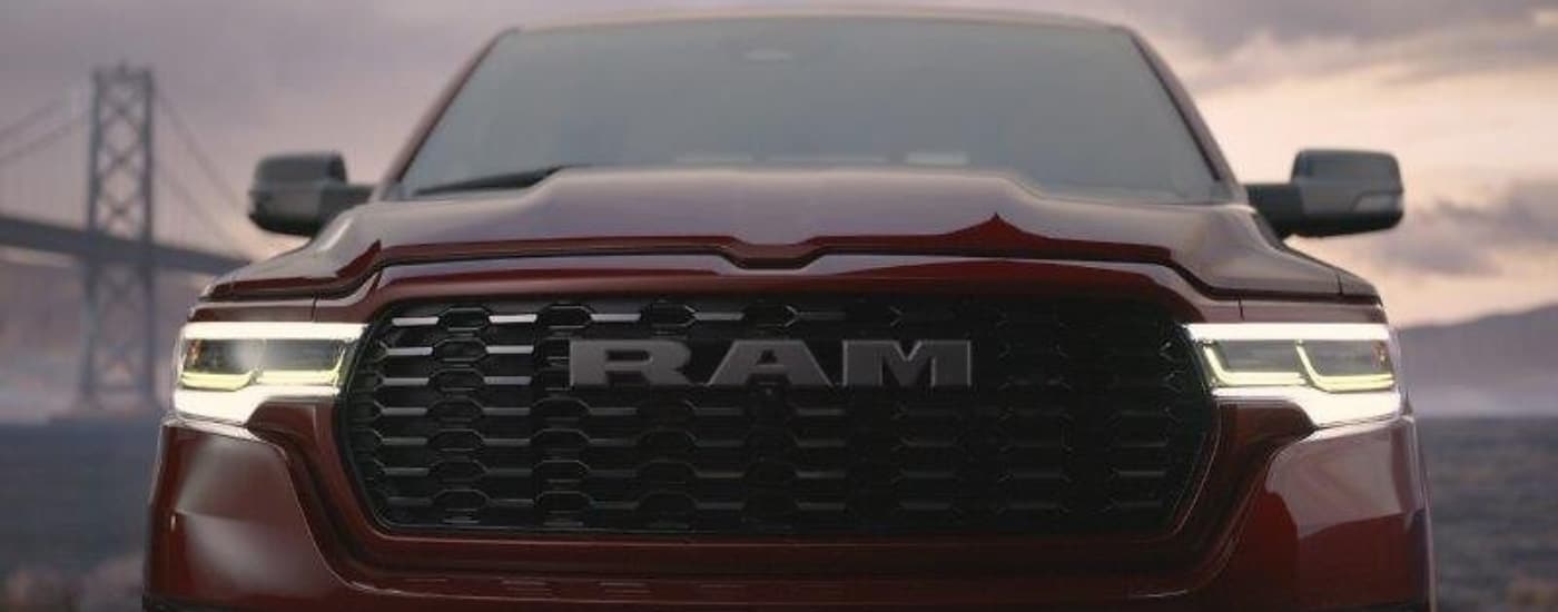 Close up of a red 2025 Ram 1500 parked head-on