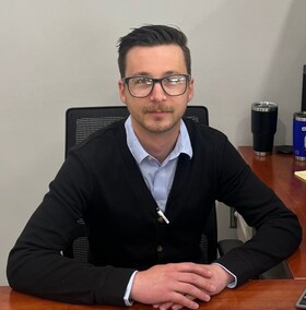 Staff member Alex Haus from 58db640f3ec8