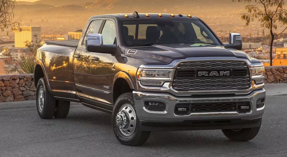 A black 2024 Ram 3500 parked and angled right.