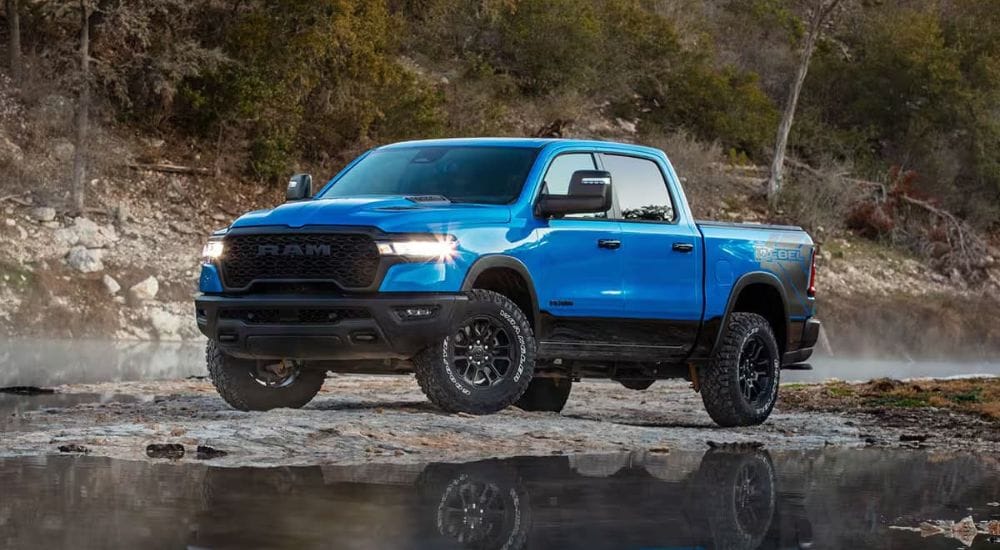 A blue  2025 Ram 1500 Rebel is shown off-road after visiting a Ram dealer near Lancaster.
