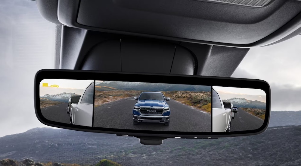 The rearview mirror of a 2024 Ram 2500 is shown in close-up.