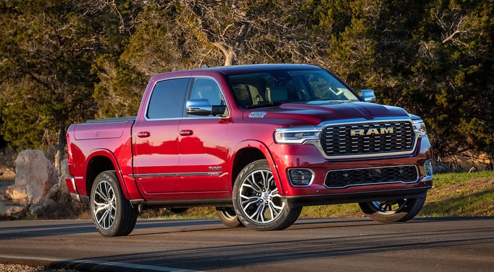 A red 2025 Ram 1500 Tungsten is shown after visiting a Jeep dealer.