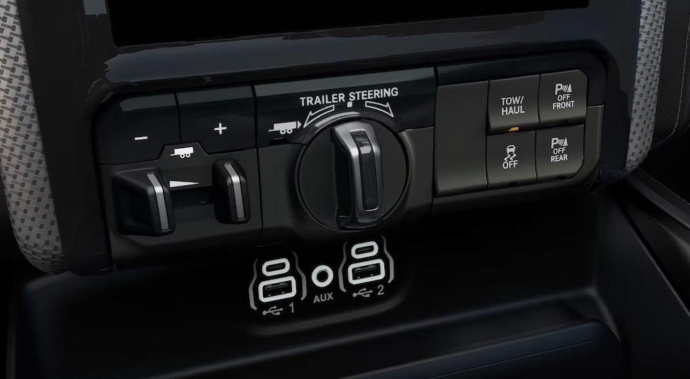 The trailer reverse steering controls are shown in a 2024 Ram 2500.