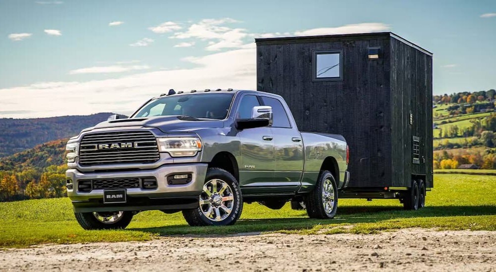 A grey 2024 Ram 2500 is shown parked on grass.