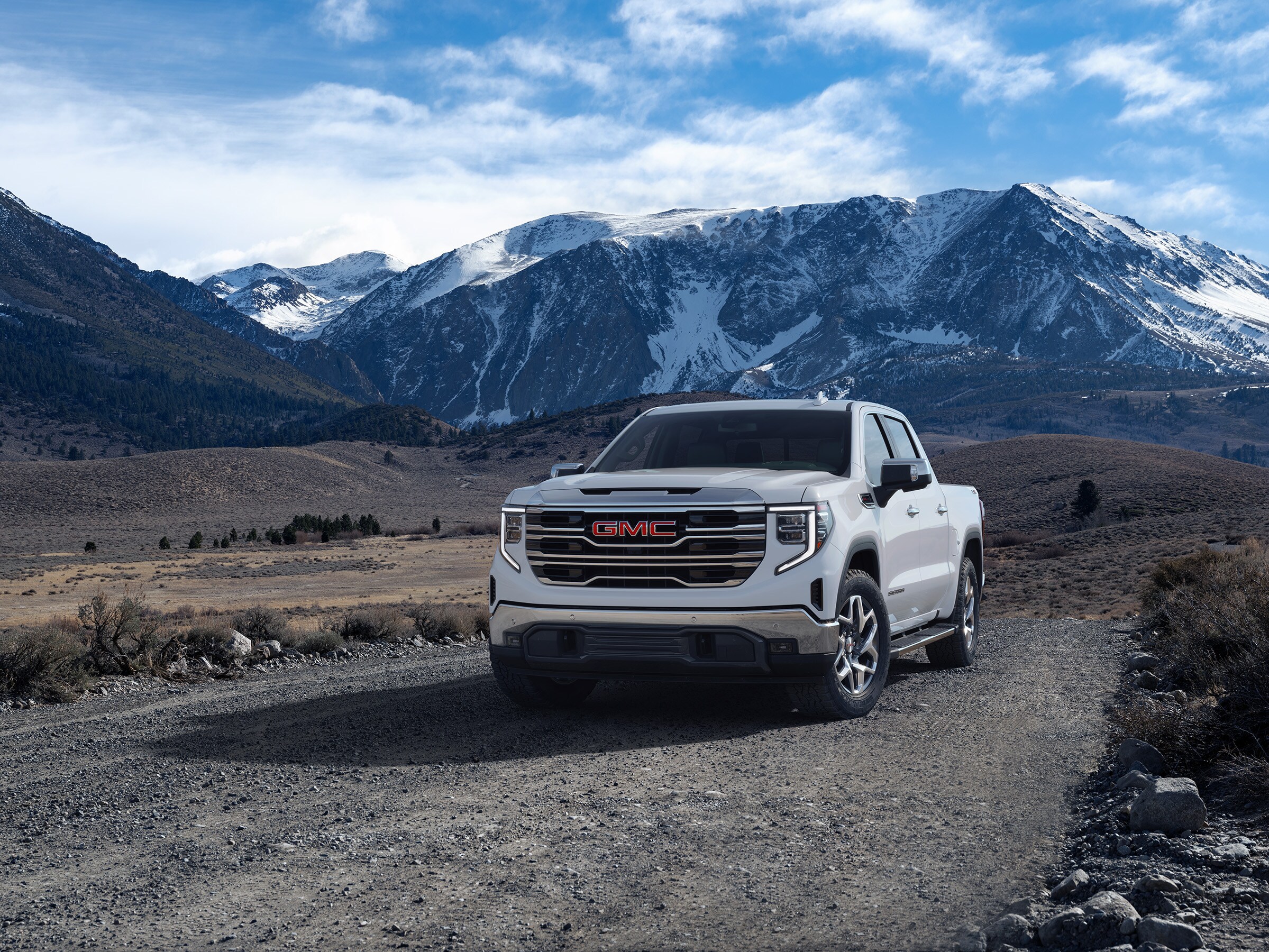 The 2026 GMC Sierra driving in a desert