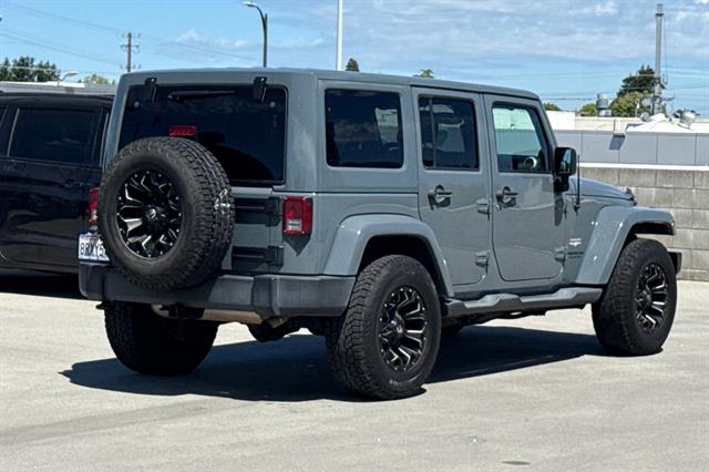 2014 Jeep Wrangler Unlimited 4x4 Sahara 4dr SUV photo 2