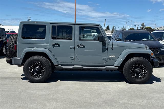 Used 2014 Jeep Wrangler Unlimited Sahara with VIN 1C4HJWEG3EL309833 for sale in Burlingame, CA