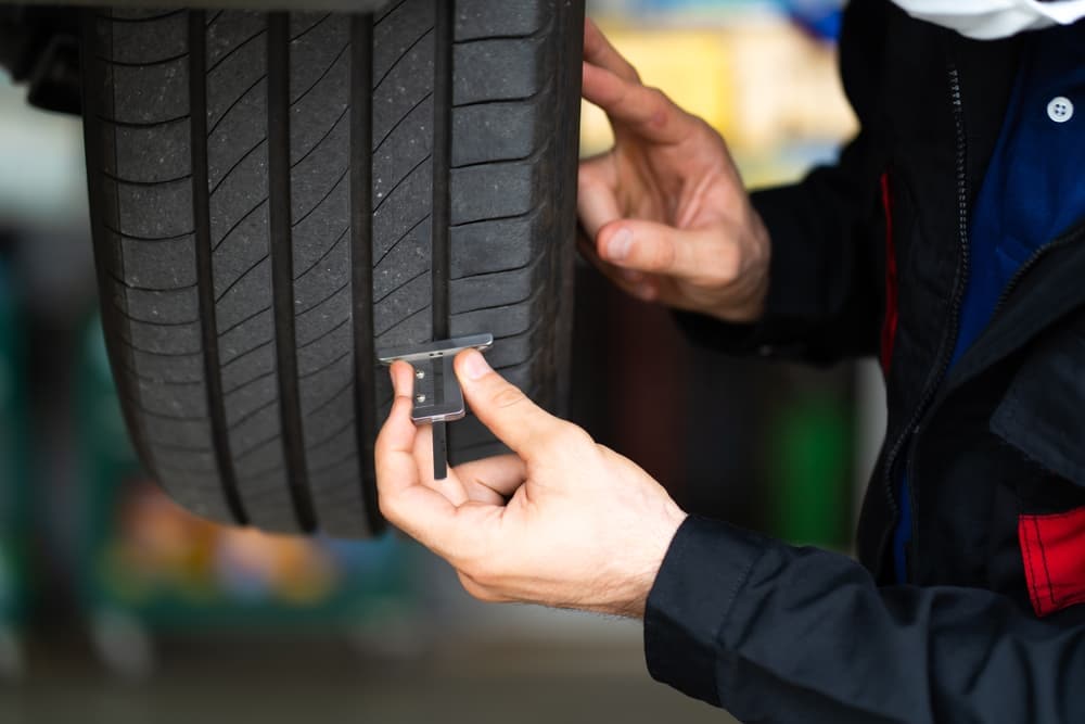 Tire Tread Being Checked.jpg