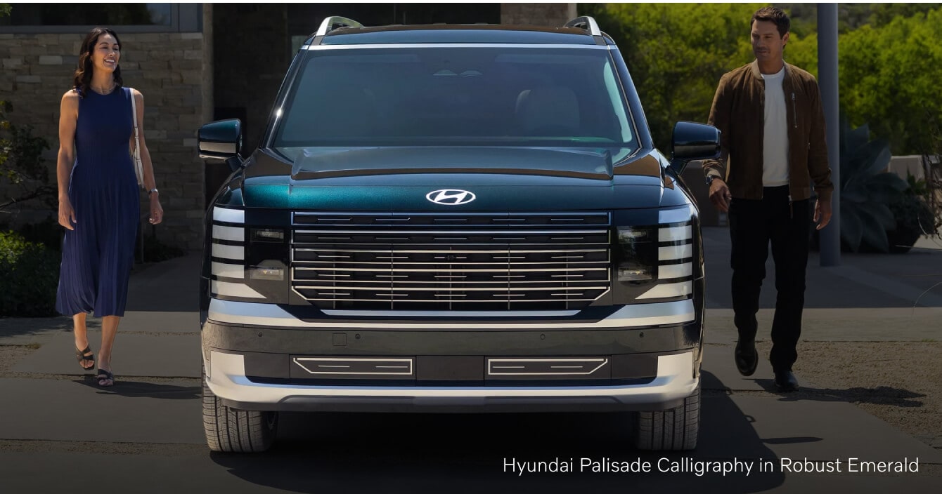 Hyundai Palisade front view on a modern residential driveway.