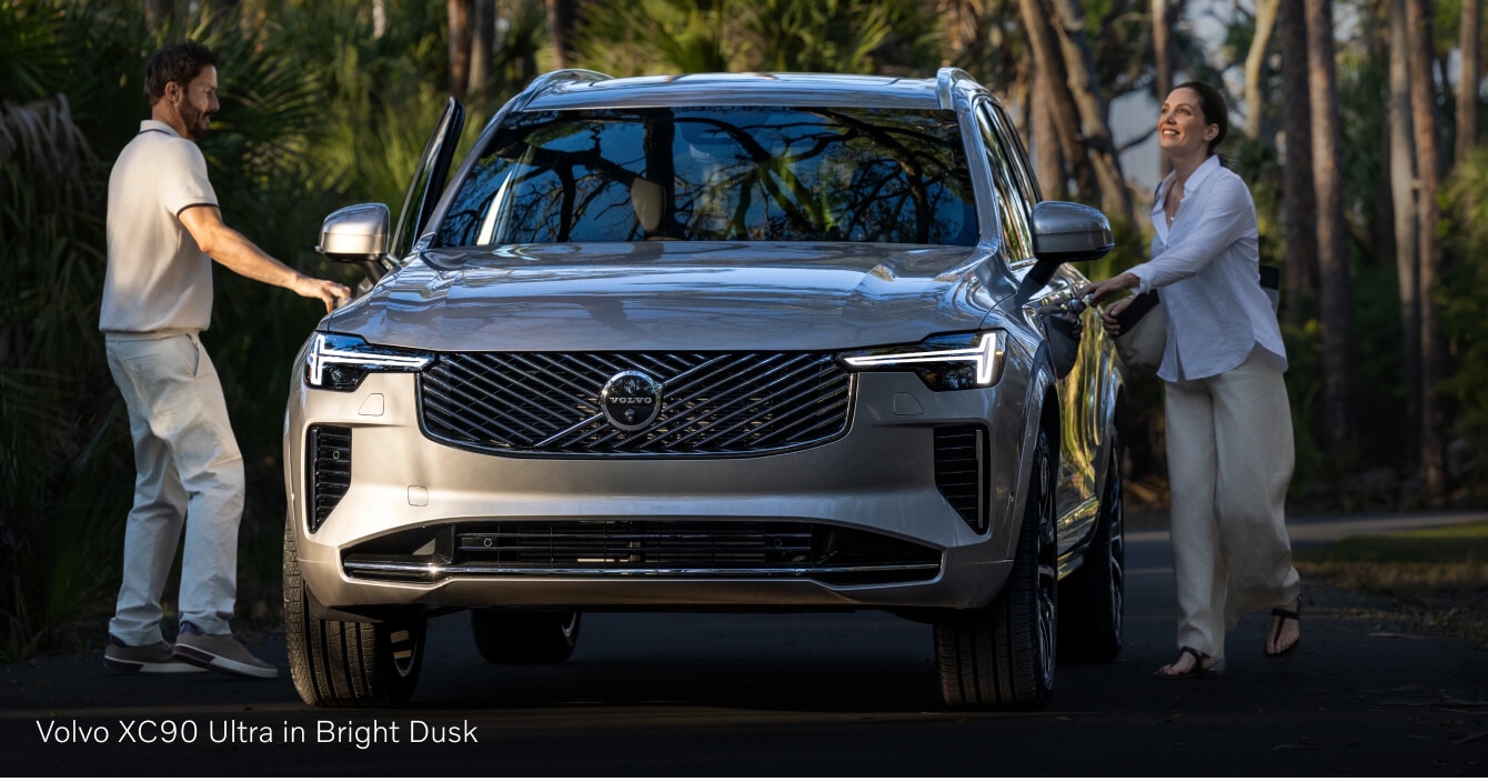 Volvo XC90 front view with doors opening in a park setting
