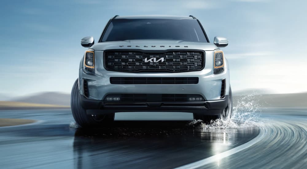 A silver 2022 Kia Telluride is shown from the front after leaving a Blue Bell Kia dealership.