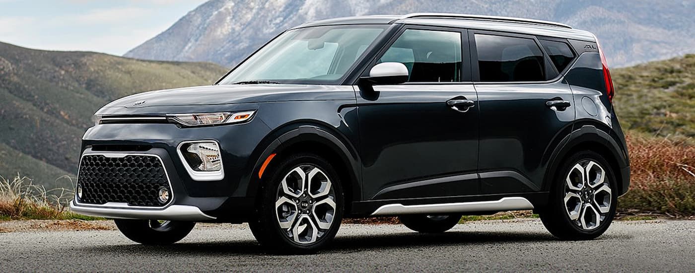 A black 2020 Kia Soul is shown from the side parked on pavement.