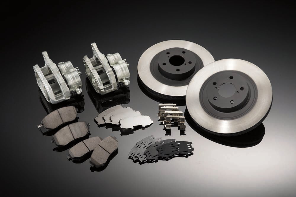 An array of Subaru parts, including brake pads and rotors