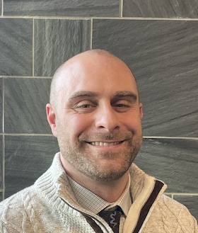 Staff member Kevin Naessans from f961a1f8aece