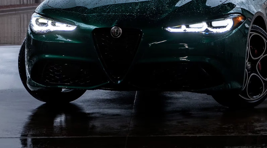 The beautiful 2026 Alfa Romeo Guilia parked outside Ramsey showing an iconic structural centerpiece known as the V Scudetto
