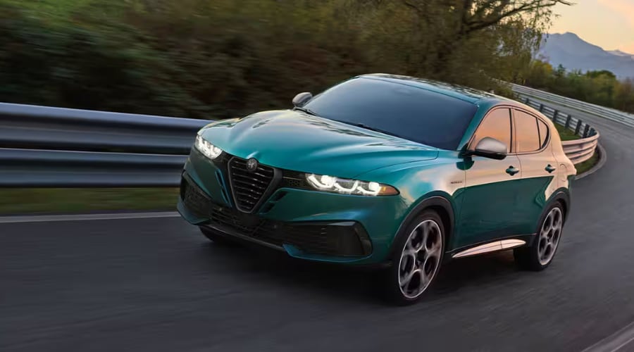 A 2026 Alfa Romeo Stelvio driving through winter weather in Wayne showcasing predictive Q4 all-wheel drive stability